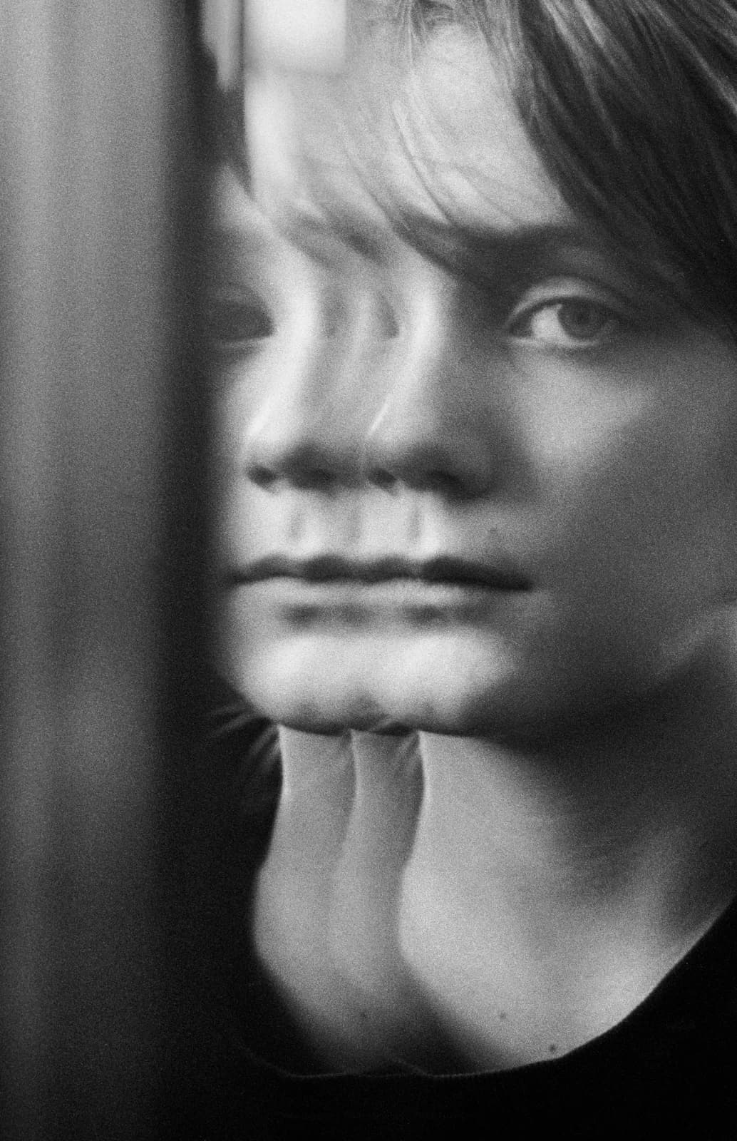 Portrait distorted through glass. From After Beauty by Maura Sullivan.