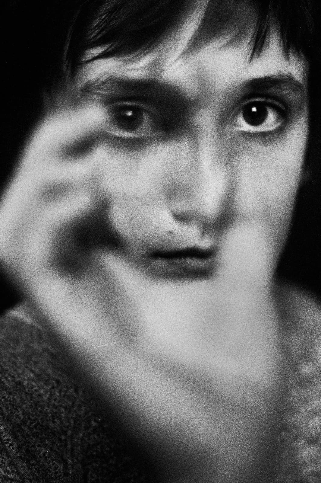 Portrait with a hand beside the face. From After Beauty by Maura Sullivan.
