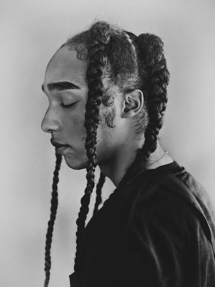 Profile portrait with braided hair. From Amsterdam Portraits by Bastiaan Woudt.