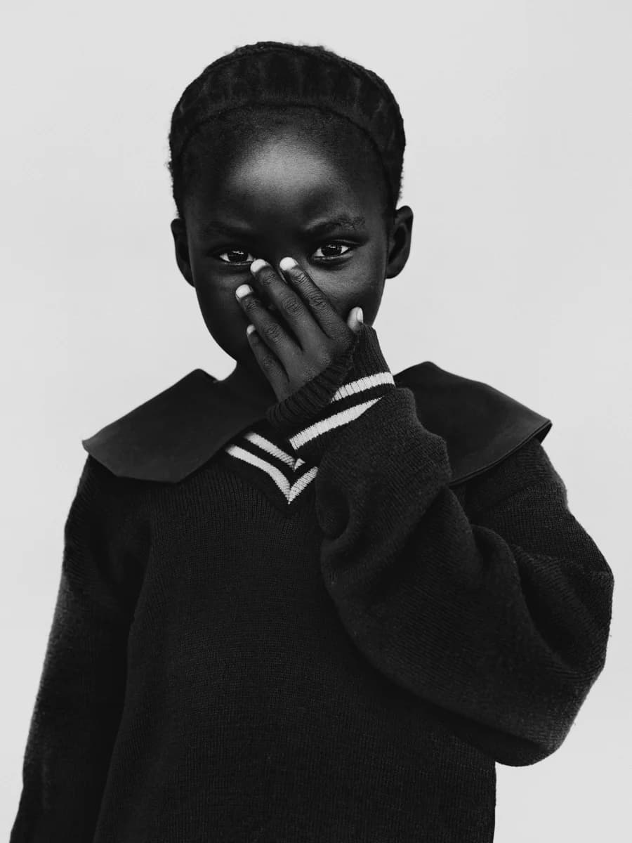 Portrait with a hand raised to the face. From Champions by Bastiaan Woudt.