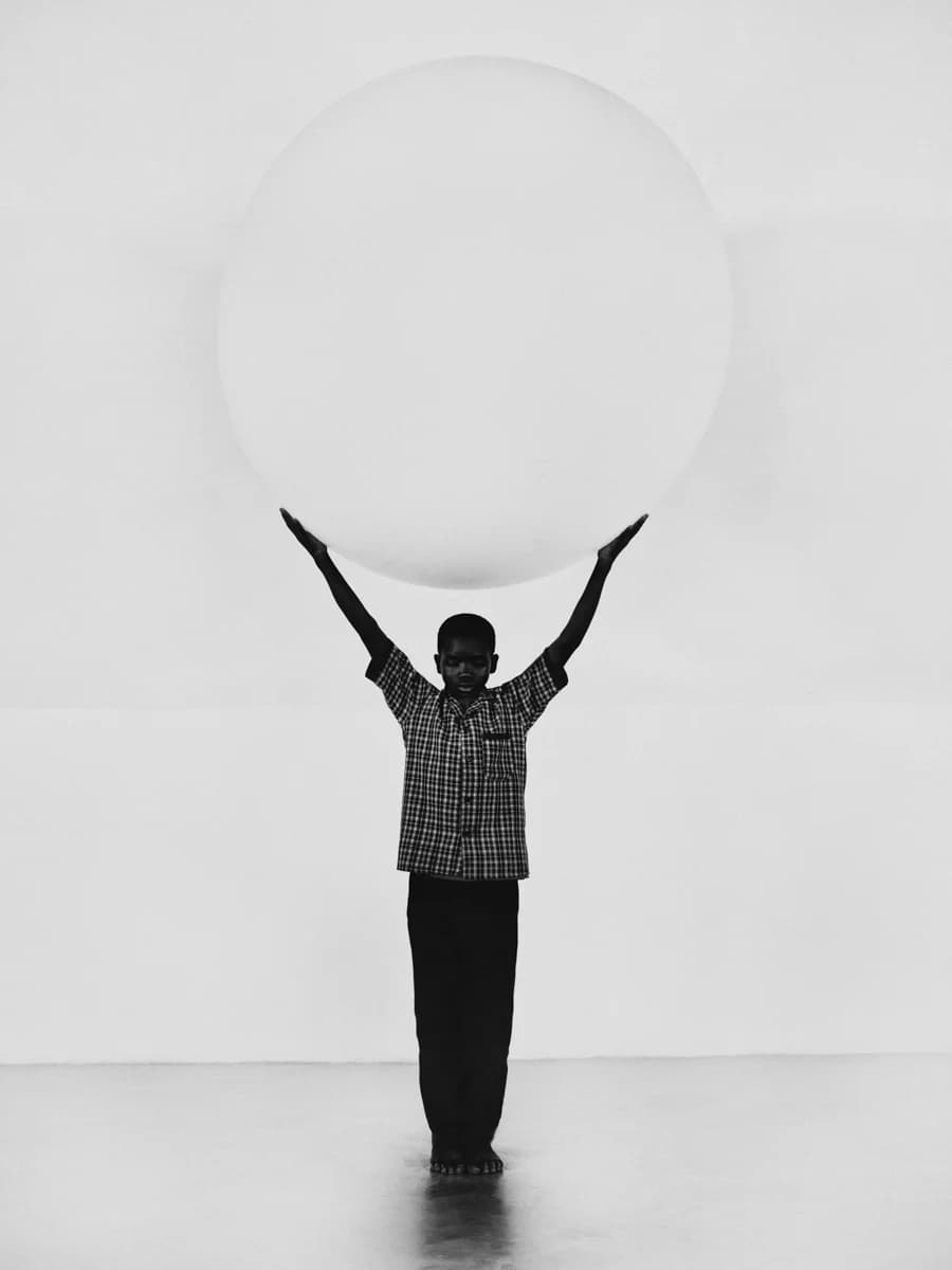 Full-length figure with arms raised. From Champions by Bastiaan Woudt.
