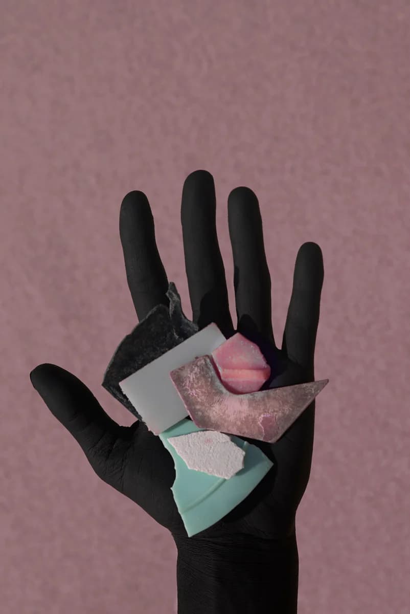 Black glove with coloured plastic fragments. From Plastic Ocean by Thirza Schaap.