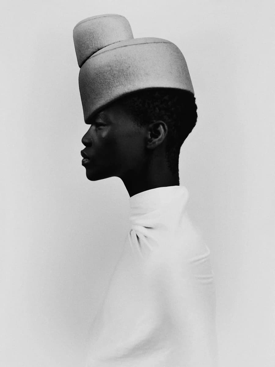 Profile portrait with a sculptural hat. From Rhythm by Bastiaan Woudt.