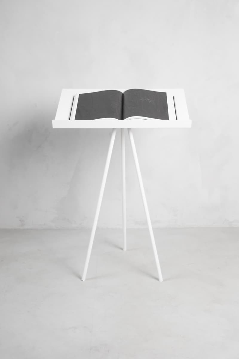 White T-Stand with an open book